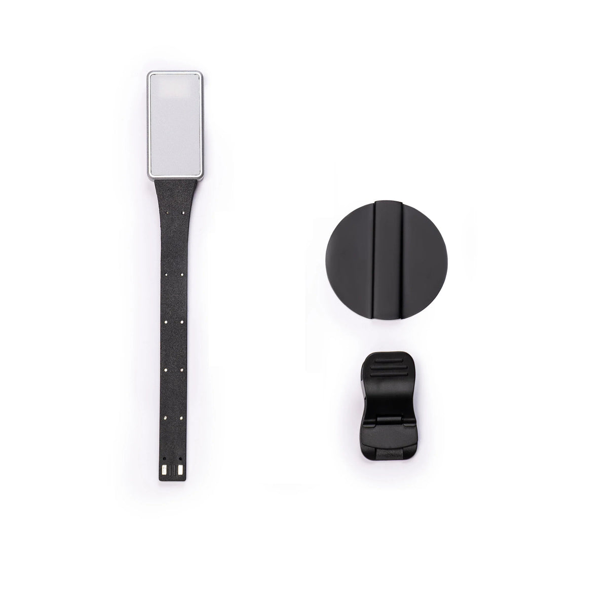 Magnetic eReader light strap with rectangular LED module and clip, plus round magnet